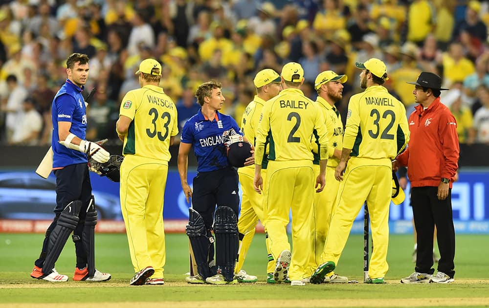 England's James Anderson and James Taylor, shake hands with Australia's cricketers after their Cricket World Cup pool A match in Melbourne, Australia.