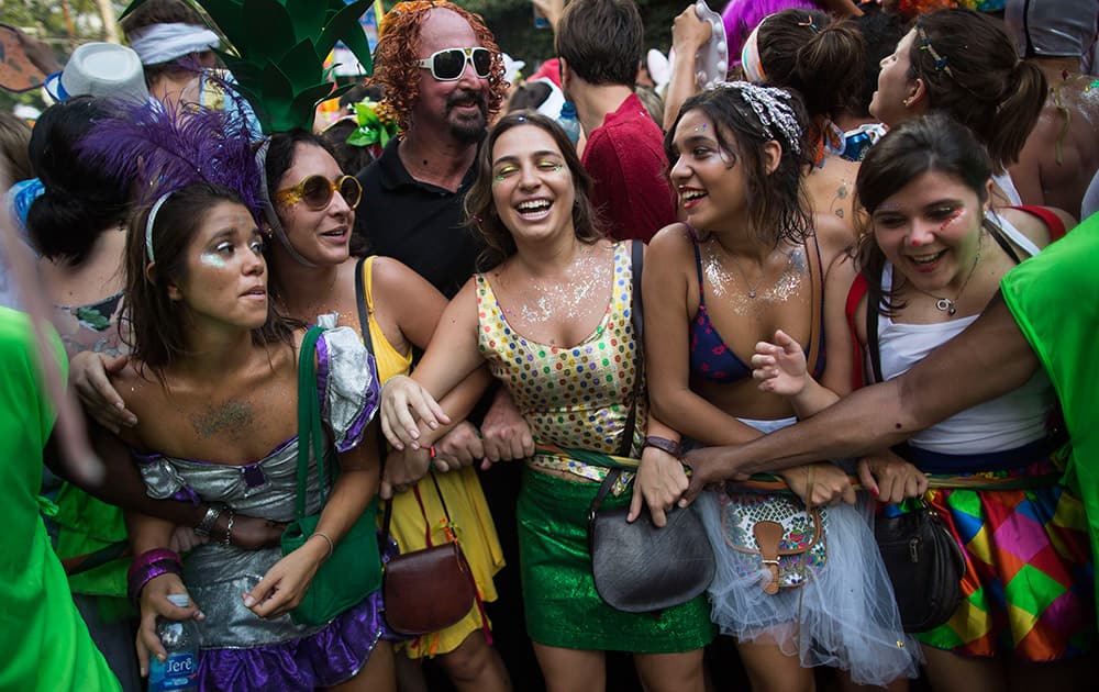 Revelers pack the streets of Santa Teresa during the 'Ceu na Terra', or Heaven on earth, carnival parade in Rio de Janeiro, Brazil.