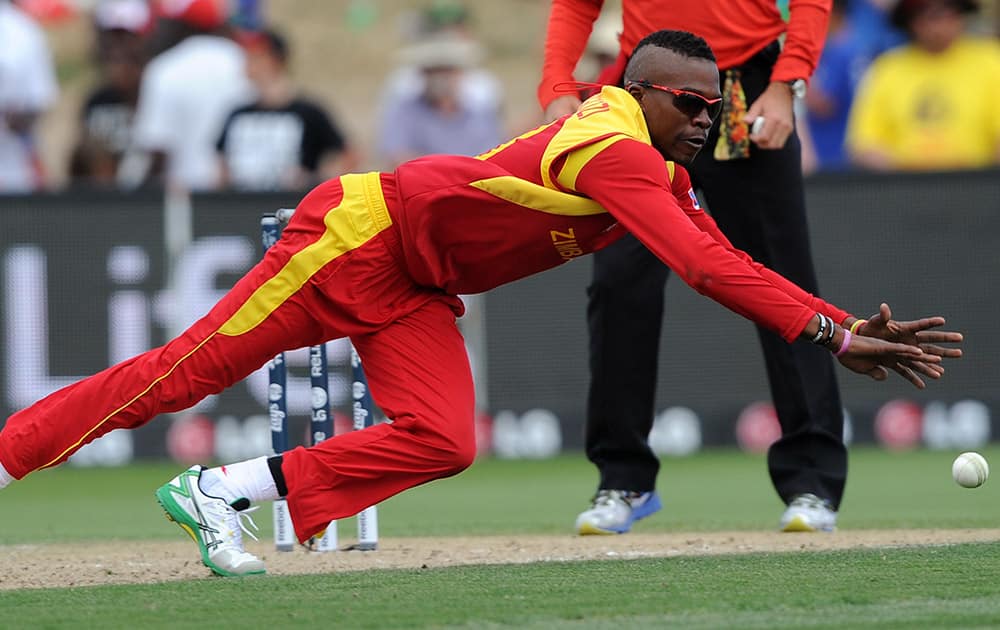 Zimbabwe's Tafadzwa Kamungozi fields the ball while bowling to South Africa during their Cricket World Cup pool B match at Hamilton, New Zealand.