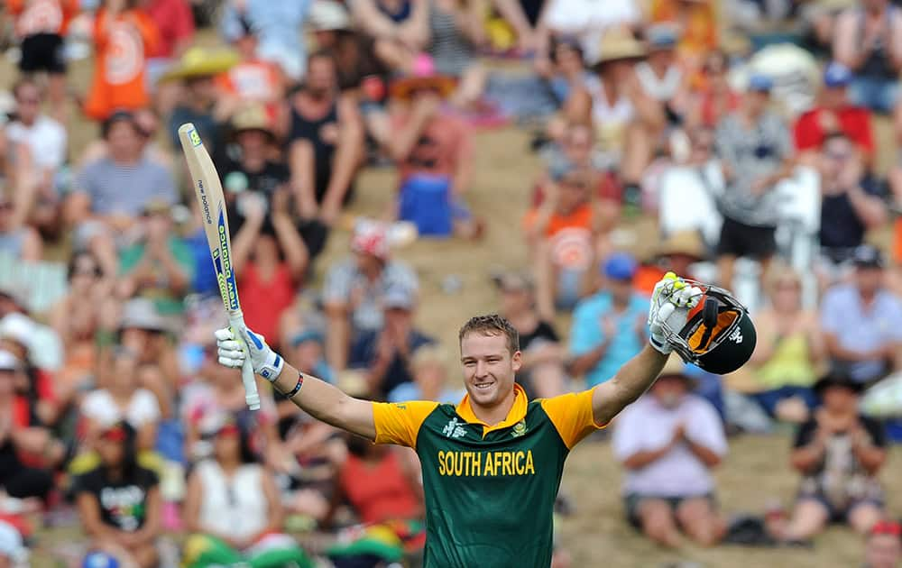 South Africa's David Miller raises his bat and helmet after making 100 runs against Zimbabwe during their Cricket World Cup pool B match at Hamilton, New Zealand.