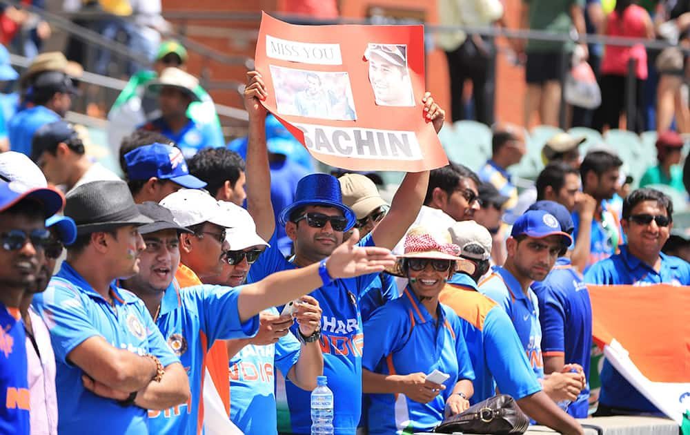 Cricket fans display a poster of Sachin Tendulkar during the World Cup Pool B match between India and Pakistan in Adelaide, Australia.