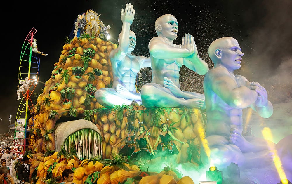 Dancers from the Vila Maria samba school perform on a float during a carnival parade in Sao Paulo, Brazil.