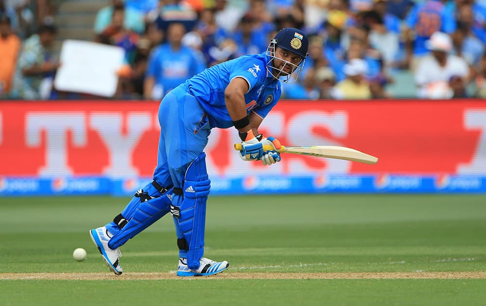 Suresh Raina, plays a shot during the World Cup Pool B match against Pakistan in Adelaide, Australia.