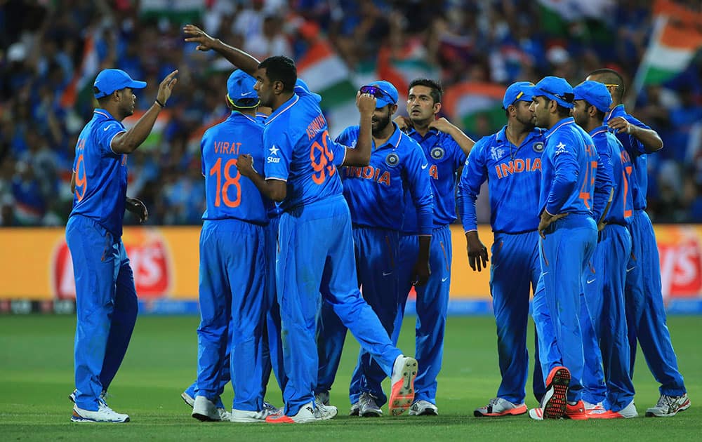 Ravichandran Ashwin, third left, celebrates with teammates the wicket of Pakistan's Haris Sohail during the World Cup Pool B match in Adelaide.