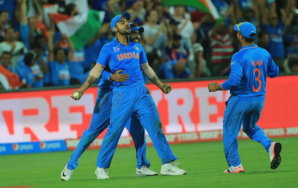 Virat Kohli, celebrates after taking a catch to dismiss Pakistan's Shahid Afridi during the World Cup Pool B match against Pakistan in Adelaide, Australia.