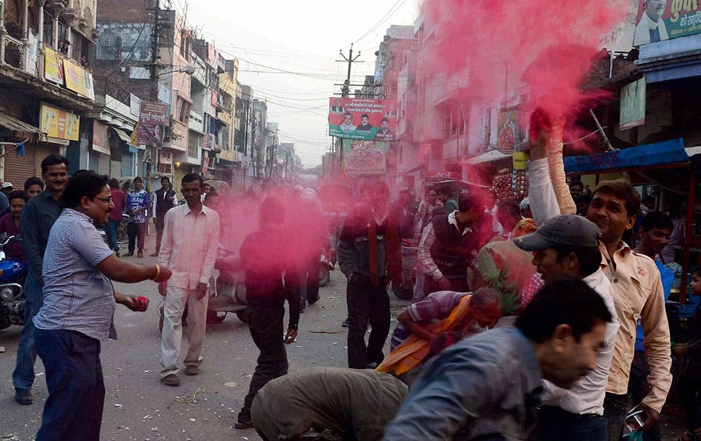 People celebrate team Indias victory against Pakistan in ICC World Cup cricket match, in Allahabad.