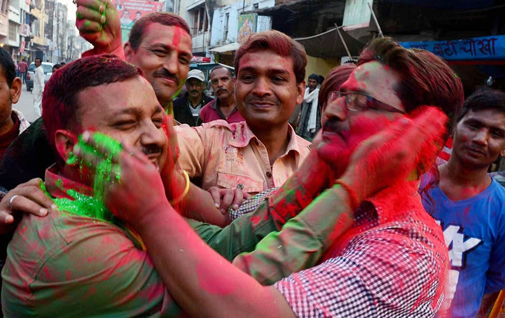 People celebrate team Indias victory against Pakistan in ICC World Cup cricket match, in Allahabad.