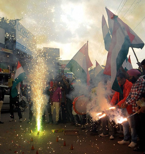 Cricket fans celebrating after India won their first match against Pakistan in ICC Cricket World Cup-2015, at Albert Ekka Chowk in Ranchi.