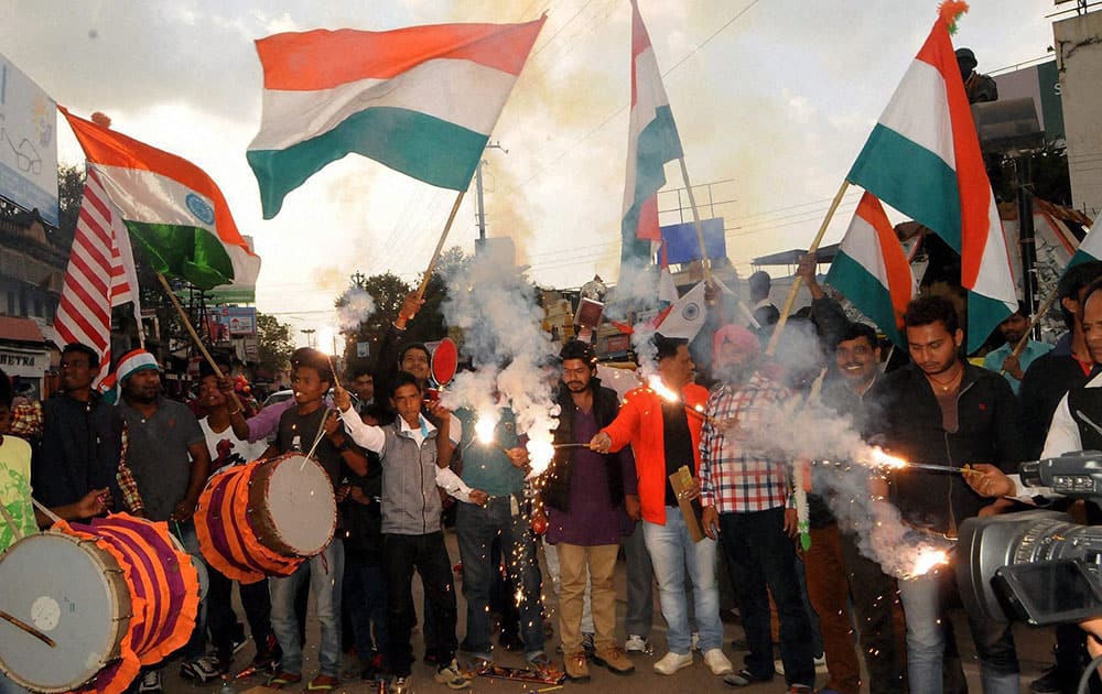 Cricket fans celebrating after India won their first match against Pakistan in ICC Cricket World Cup-2015, at Albert Ekka Chowk in Ranchi.