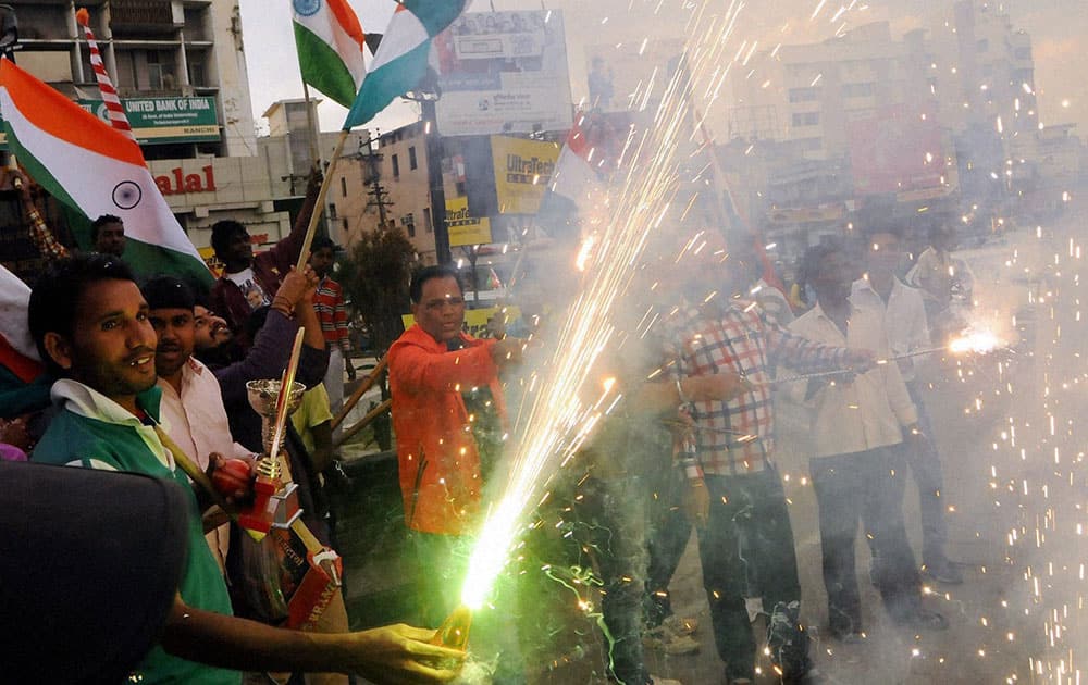 Cricket fans celebrating after India won their first match against Pakistan in ICC Cricket World Cup-2015, at Albert Ekka Chowk in Ranchi.