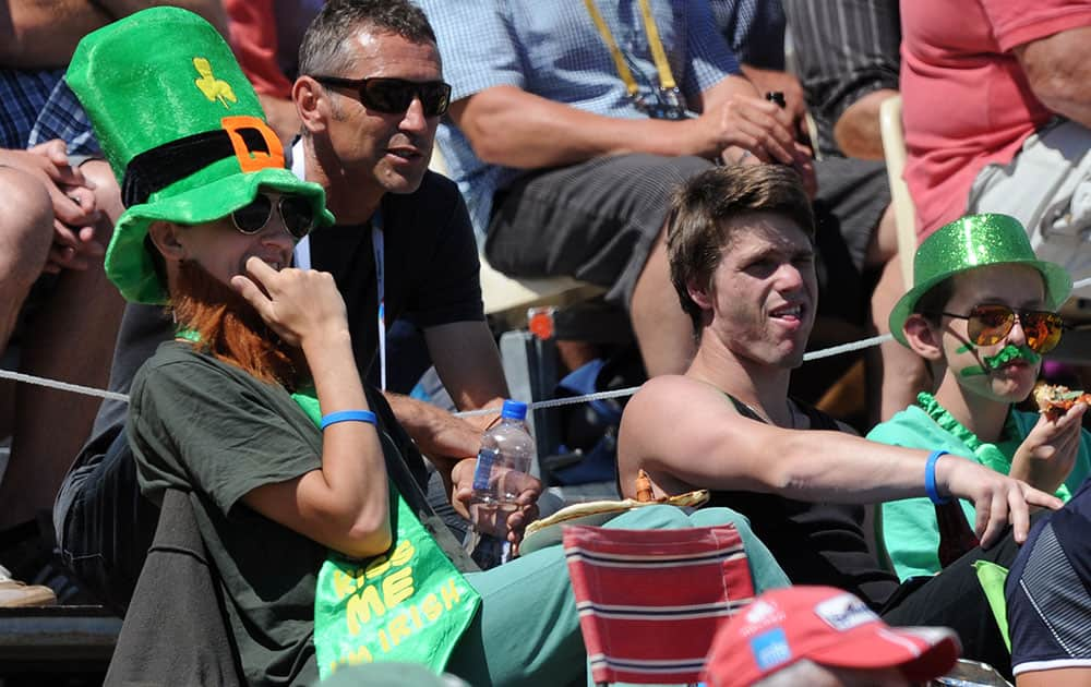 An Ireland fan in a green top hat watches from the stands as Ireland and West Indies play in their Cricket World Cup pool B match at Nelson, New Zealand.