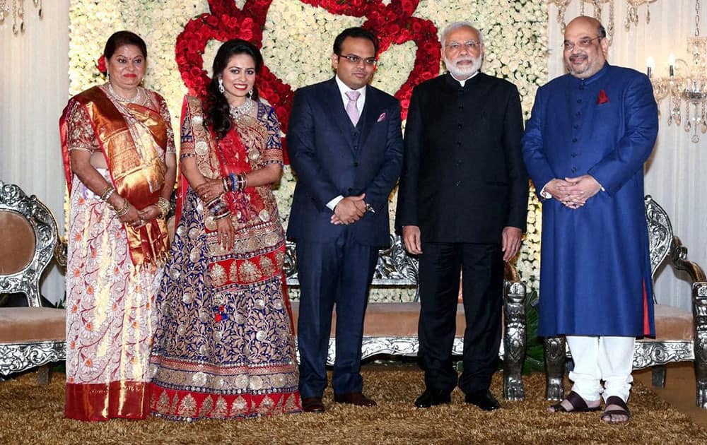 Prime Minister Narendra Modi with BJP National President Amit shah and his son Jay and daughter in law Rishita during their wedding reception in New Delhi.