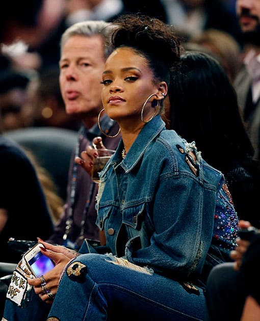 Rhianna watches the first half of the NBA All-Star basketball game, in New York.