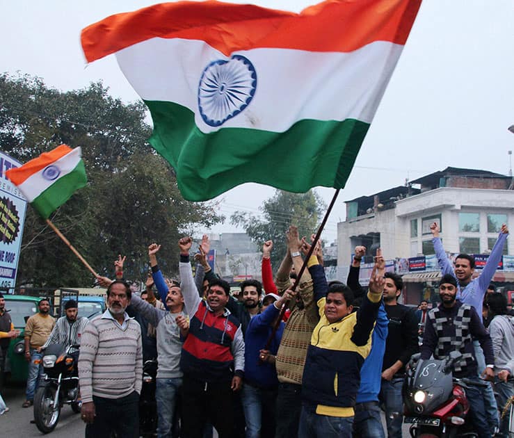 Cricket fans celebrating after team India won their first match against Pakistan in ICC Cricket World Cup-2015, in Jammu.