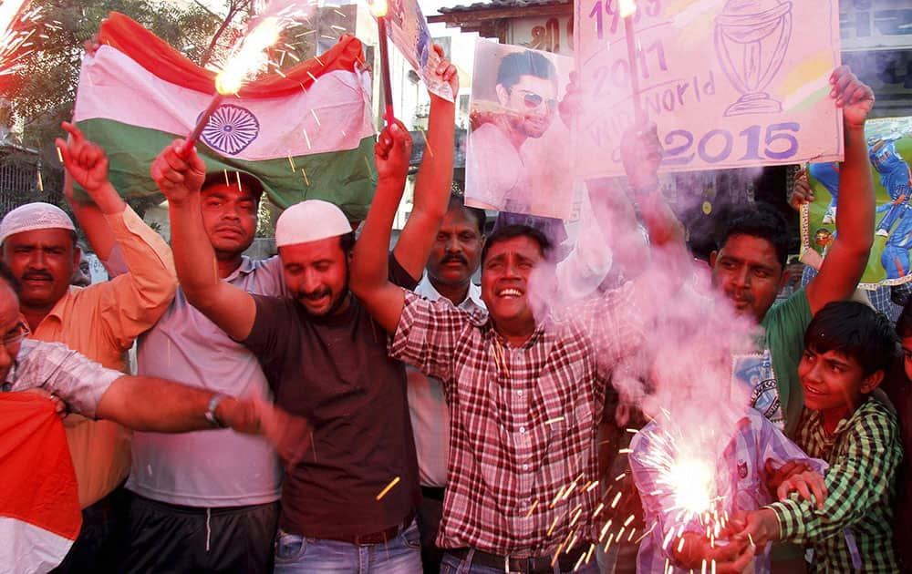 Cricket fans celebrating after team India's victory in the ICC World Cup Pool B match against Pakistan, in Ahmedabad.