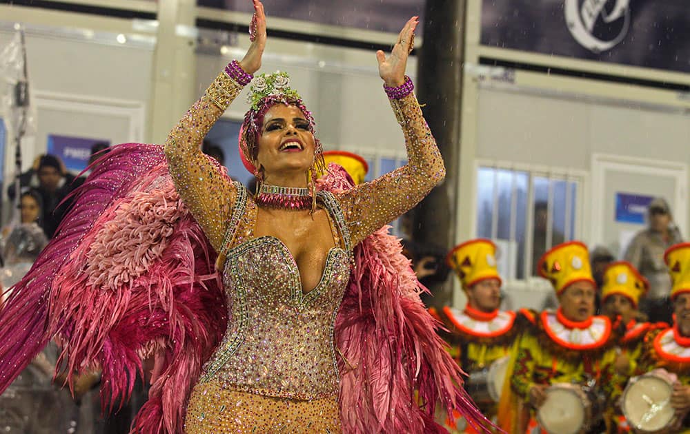Drum queen Raissa Machado representing the Viradouro samba school, dances during the Carnival parade at the Sambadrome in Rio de Janeiro.
