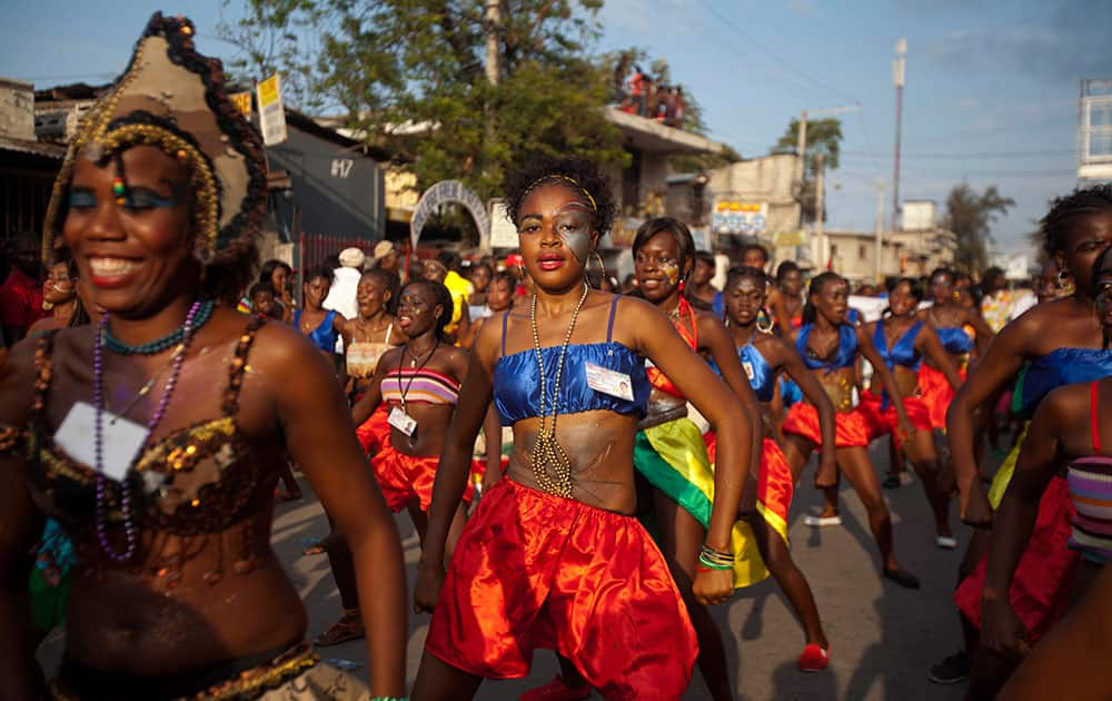 Dancers perform in a street parade, kicking off Carnival celebrations in Port-au-Prince, Haiti.