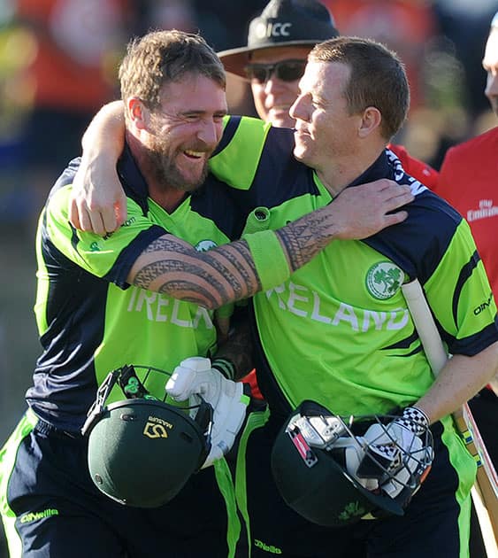 Ireland's not out batsmen John Mooney, left, and Niall O'Brien, right, embrace as they walk off after defeating West Indies during their Cricket World Cup pool B match at Nelson, New Zealand.