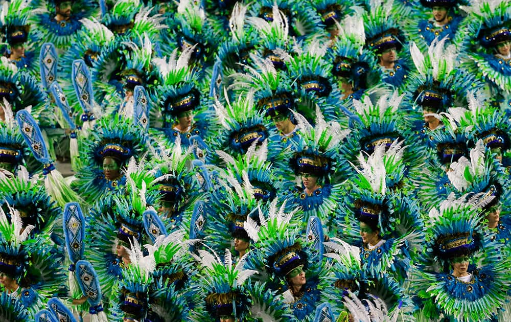 Performers from the Vila Isabel samba school parade during carnival celebrations at the Sambadrome in Rio de Janeiro, Brazil.