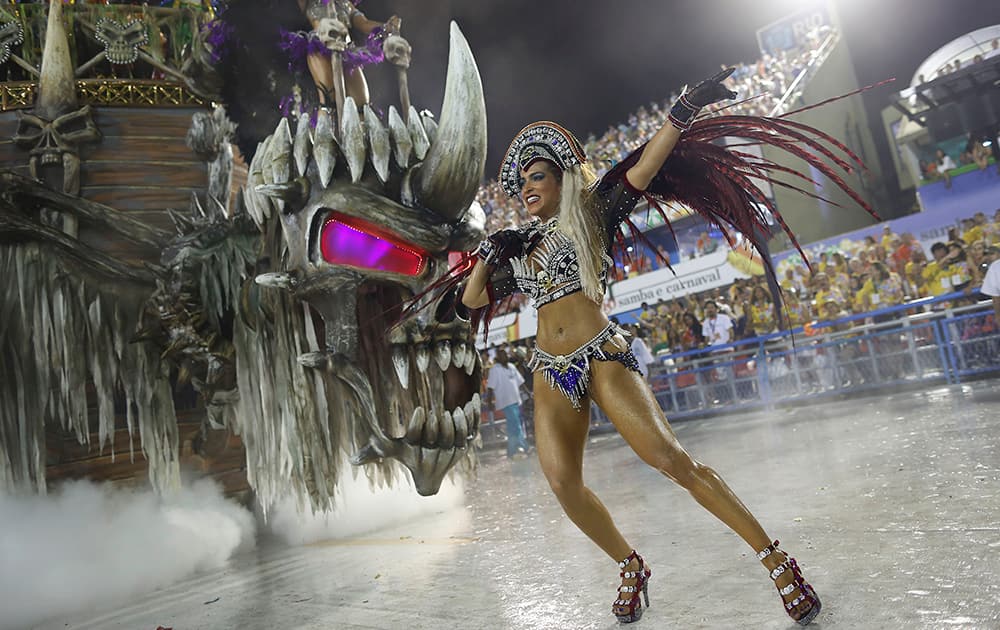 A performer from the Vila Isabel samba school parades during carnival celebrations at the Sambadrome in Rio de Janeiro, Brazil.