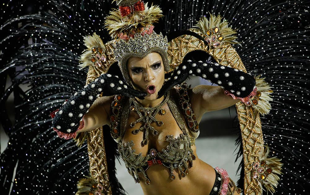 A performer from the Salgueiro samba school parades during carnival celebrations at the Sambadrome in Rio de Janeiro, Brazil.