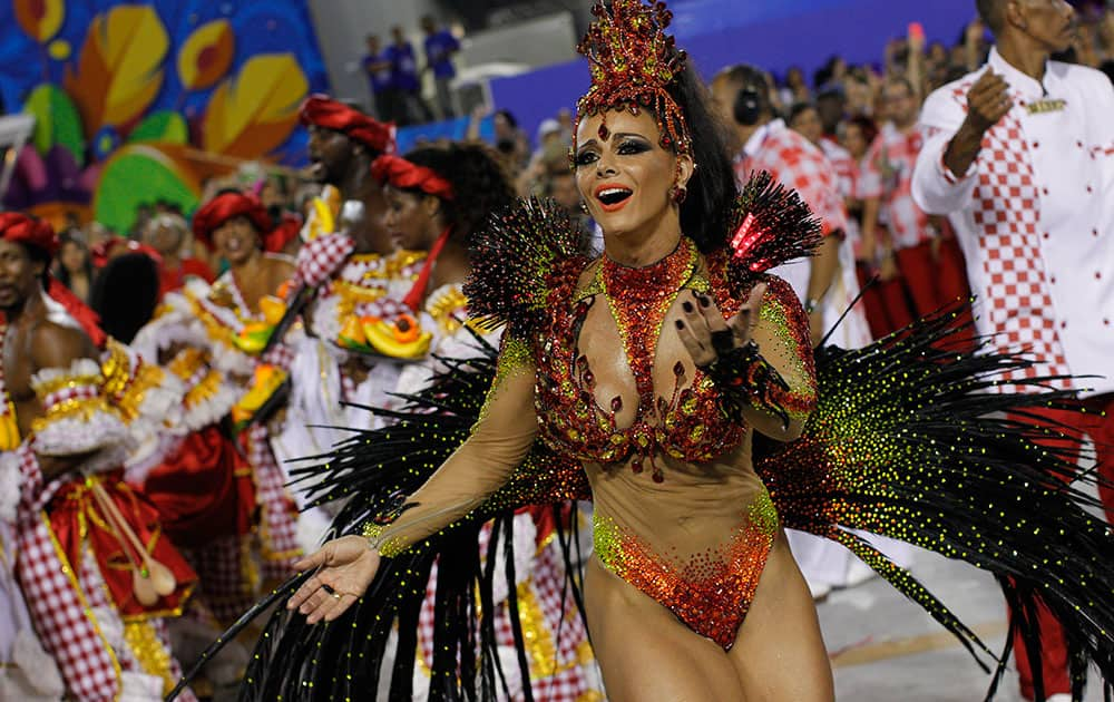 Drum queen Viviane Araujo, from Salgueiro samba school, dances during carnival parade at the Sambadrome in Rio de Janeiro.