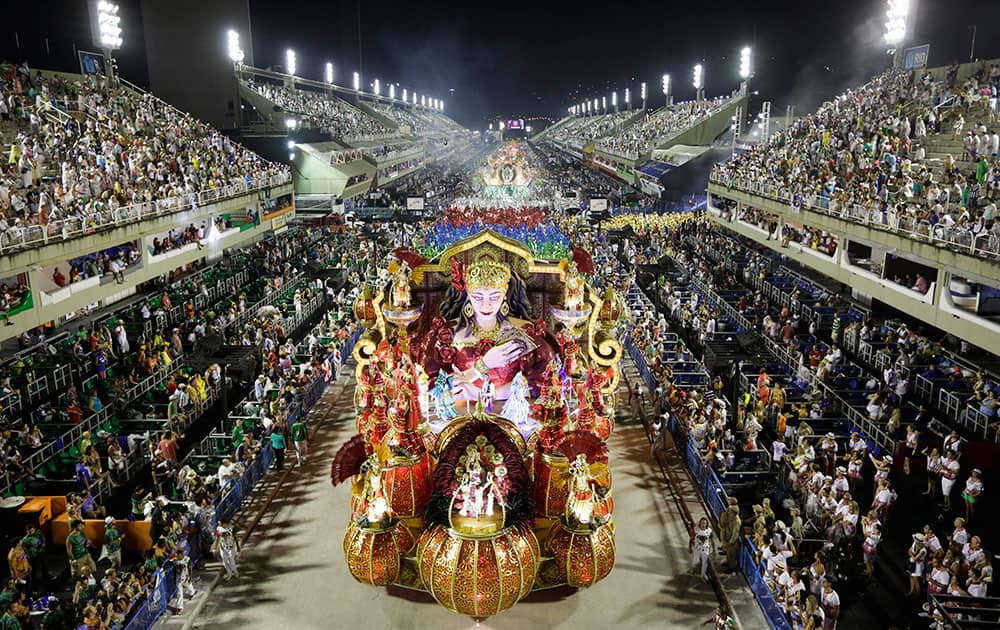 Performers from the Academicos do Grande Rio samba school parade during carnival celebrations at the Sambadrome in Rio de Janeiro, Brazil.