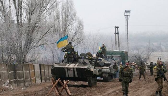Ukraine says won`t pull back heavy weapons because of rebel fire