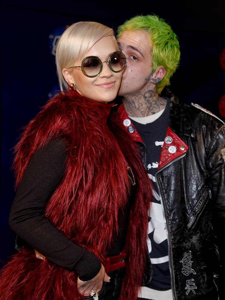 Rita Ora, left, and Richard Hilfiger attend the Tommy Hilfiger Fall 2015 show during Mercedes-Benz Fashion Week Fall 2015 at The Park Avenue Armory, in New York.