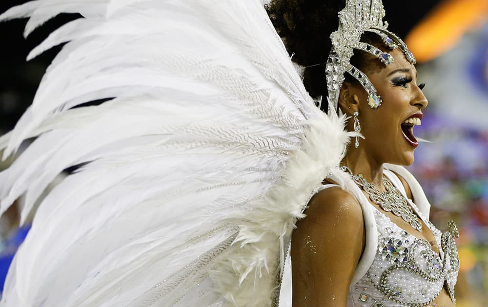 Brazilian actress Sheron Menezzes from the Portela samba school sings out in the Carnival parade at the Sambadrome in Rio de Janeiro, Brazil.