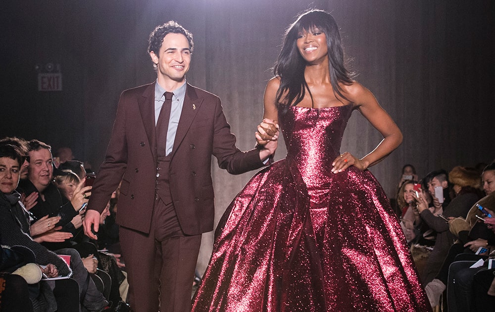 Designer Zac Posen and model Naomi Campbell greet the crowd after his Fall 2015 collection is modeled during Fashion Week, in New York. 