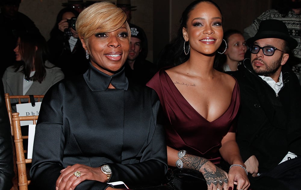 Mary J. Blige and Rihanna attend the Zac Posen Fall 2015 show during Mercedes-Benz Fashion Week Fall 2015 at Grand Central Terminal, in New York. 