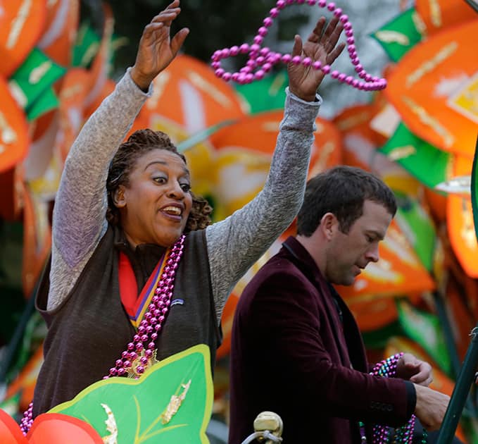 CCH Pounder, actress on the television series NCIS New Orleans, throws beads from a float during the Krewe of Proteus parade in New Orleans. The day is known as Lundi Gras, the day before Mardi Gras.