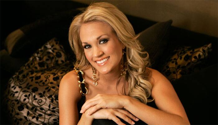 Carrie Underwood donates guitar to save police dog