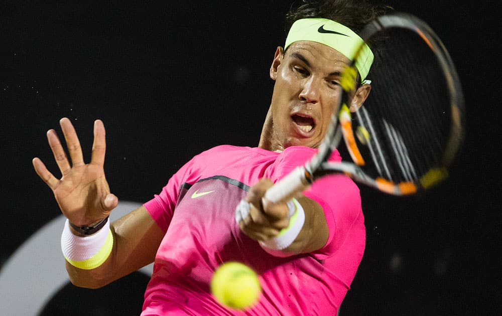 Rafael Nadal of Spain, returns the ball to Thomaz Bellucci of Brazil, in their Rio Open tennis tournament match.