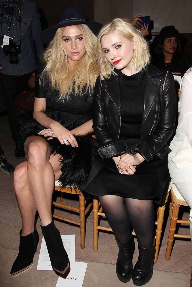 Kesha, left, and Abigail Breslin attend the Zac Posen Fall 2015 show during Fashion Week in New York.