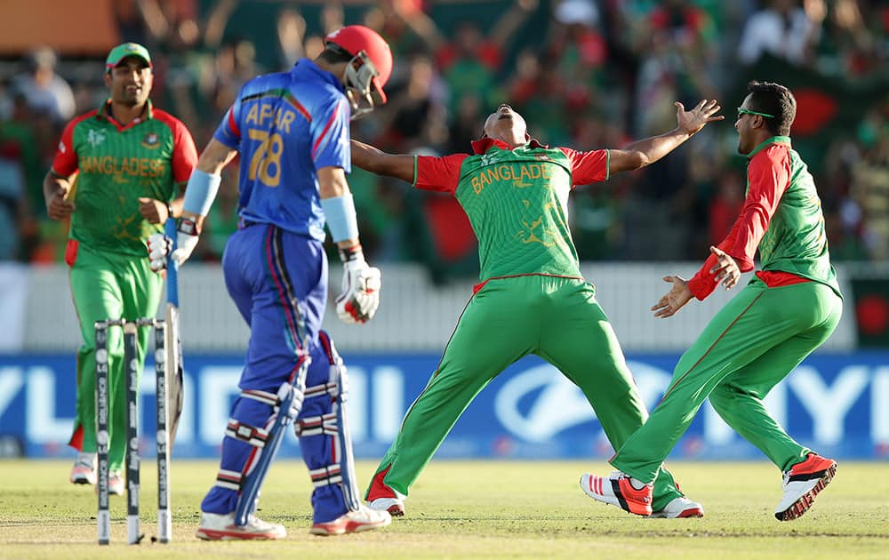 Bangladesh’s Rubel Hossain celebrates after dismissing Afghanistan’s Afsar Zazai during their Cricket World Cup Pool A match in Canberra, Australia.