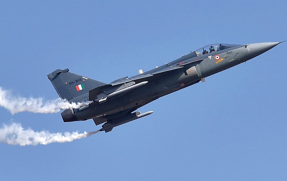 Light Combat Aircraft Tejas performs during the inauguration of the Aero India 2015 event at Yelhanka Air Base in Bengaluru.