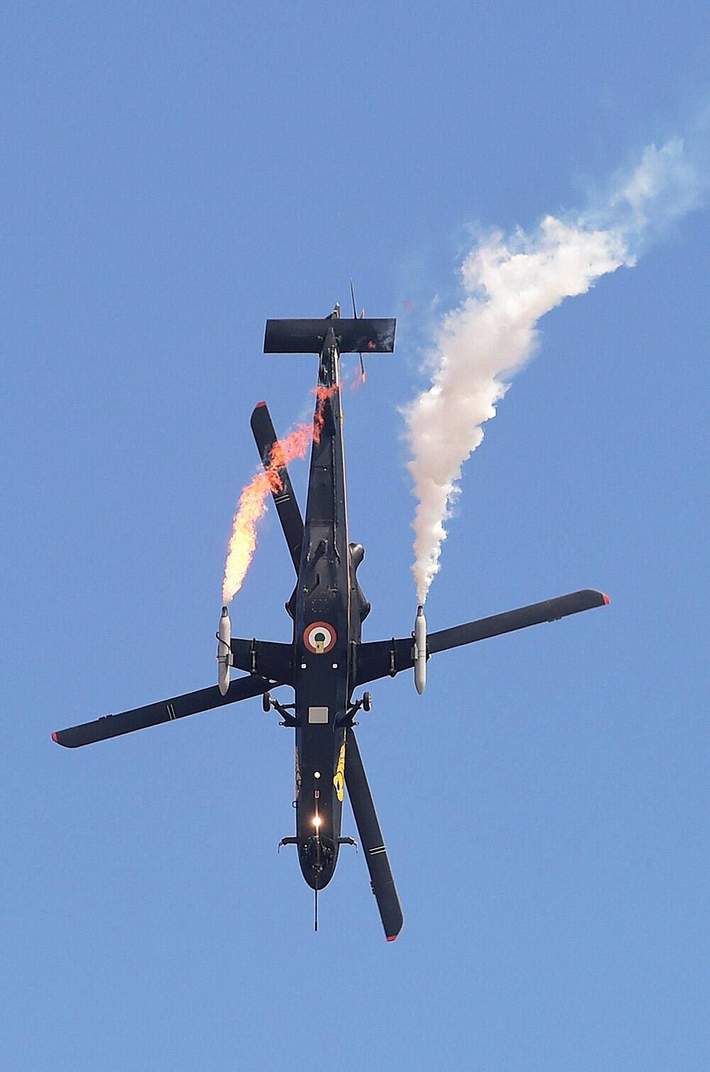 The Indian Air Forces’ light combat helicopter Rudra performs during the inauguration of the Aero India 2015 event at Yelhanka Air Base in Bengaluru.