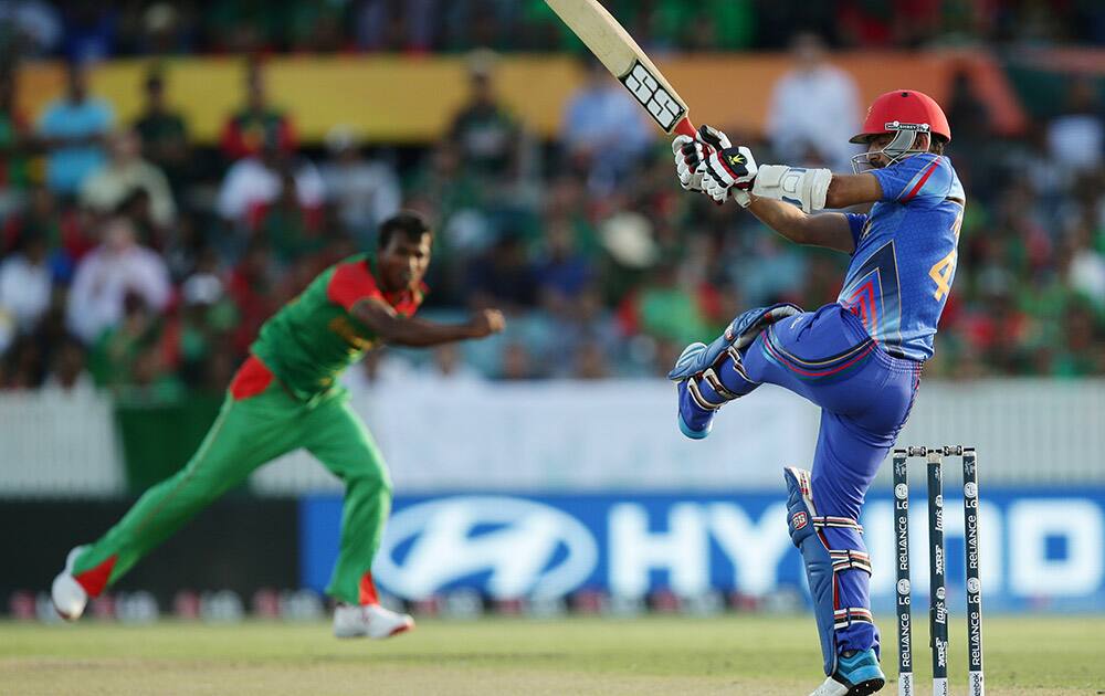 Afghanistan batsman Samiullah Shenwari plays at a ball during their Cricket World Cup Pool A match against Bangladesh in Canberra, Australia.