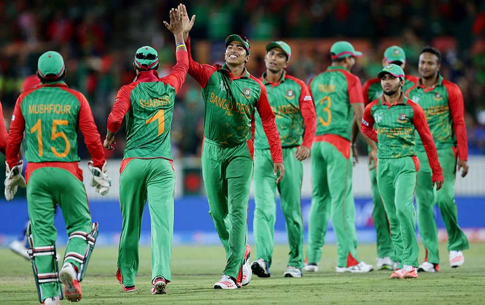 Bangladesh’s players celebrate during their Cricket World Cup Pool A match against Afghanistan in Canberra, Australia. Bangladesh defeated Afghanistan by 105 runs.