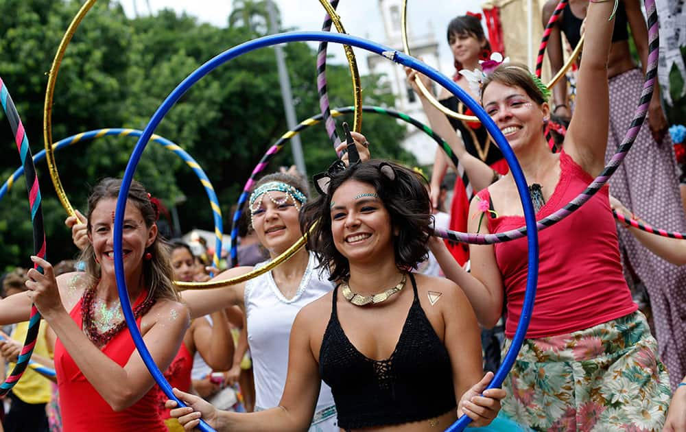 Women attend the “Mulheres Rodadas” block carnival parade in Rio de Janeiro, Brazil. As Carnival season winds down in Brazil, hundreds of women have gathered for a street party to mock the social stigma tied to them being sexually experienced.