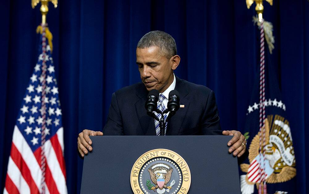 President Barack Obama pauses as he turns to walk from the stage after speaking in the Eisenhower Executive Office Building in the White House Complex in Washington.