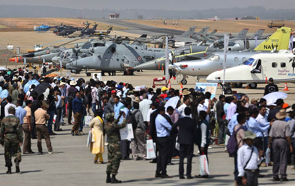 Visitors crowd the static aircraft display area on the second day of Aero India 2015 at Yelahanka air base in Bangalore.