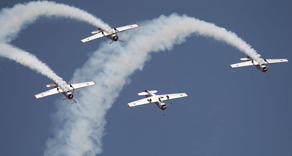 Russian aerobatic team Yakovlev fly upside down on the second day of Aero India 2015 at Yelahanka air base in Bangalore.