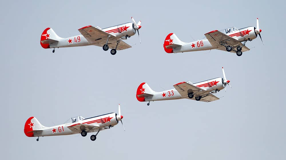 Russian aerobatic team Yakovlev fly in a formation on the second day of Aero India 2015 at Yelahanka air base in Bangalore.