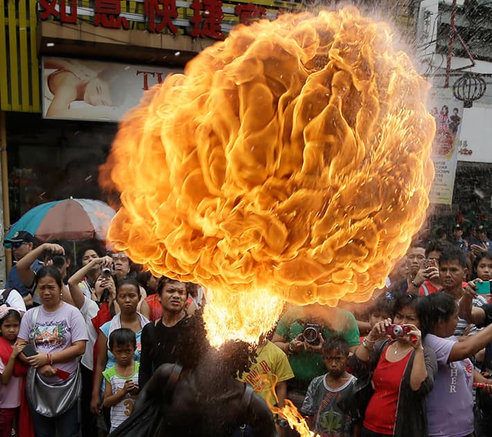 A fire-eater performs at Manila's Chinatown district of Binondo to celebrate the Chinese New Year, in Manila, Philippines.