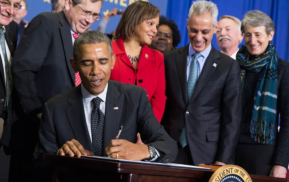 President Barack Obama signs a proclamation in Chicago, to designate the Pullman National Monument — commemorating African-Americans who served as porters, waiters and maids on the iconic Pullman sleeper cars. 