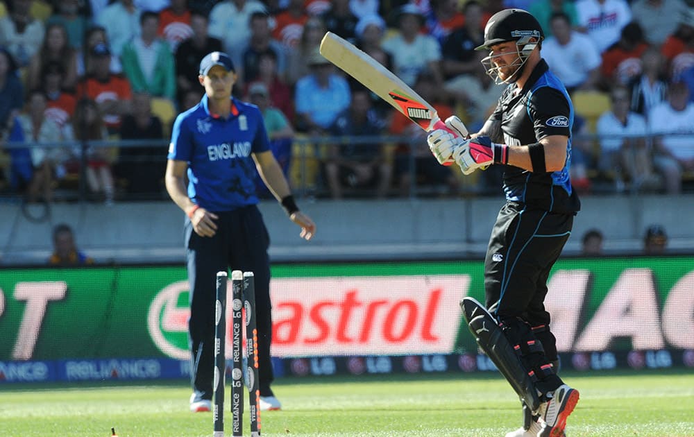 New Zealand batsman Brendon McCullum looks around to see he is bowled for 77 runs during their Cricket World Cup match against England in Wellington, New Zealand