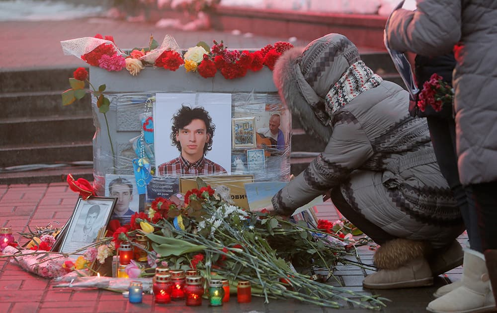 People pay their respects in honor of the 'Heavenly Hundred' on Independence Square in Kiev, Ukraine.